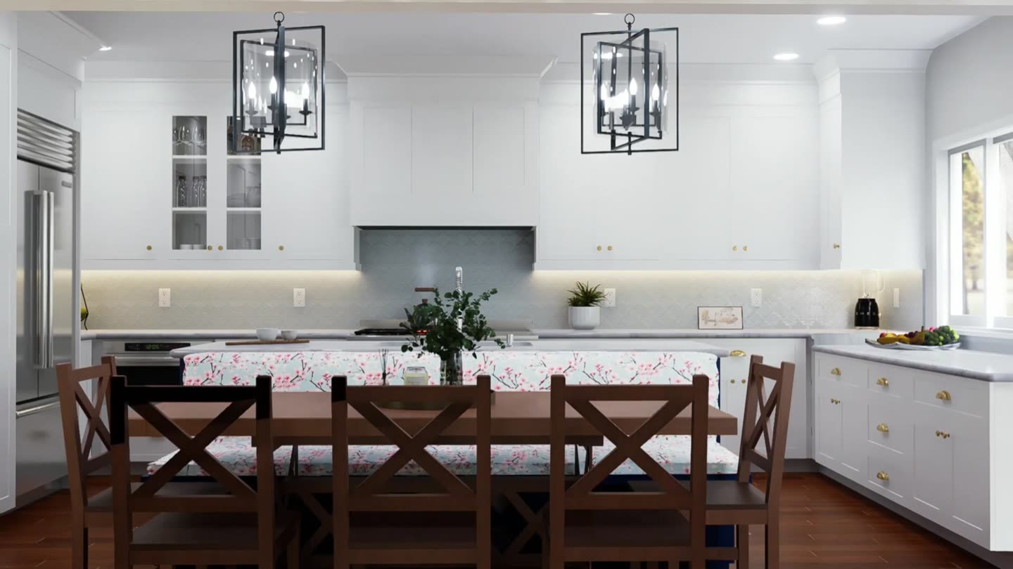 A finished kitchen: cream cabinetry, a sage island, oak floor, morning light through the far window.